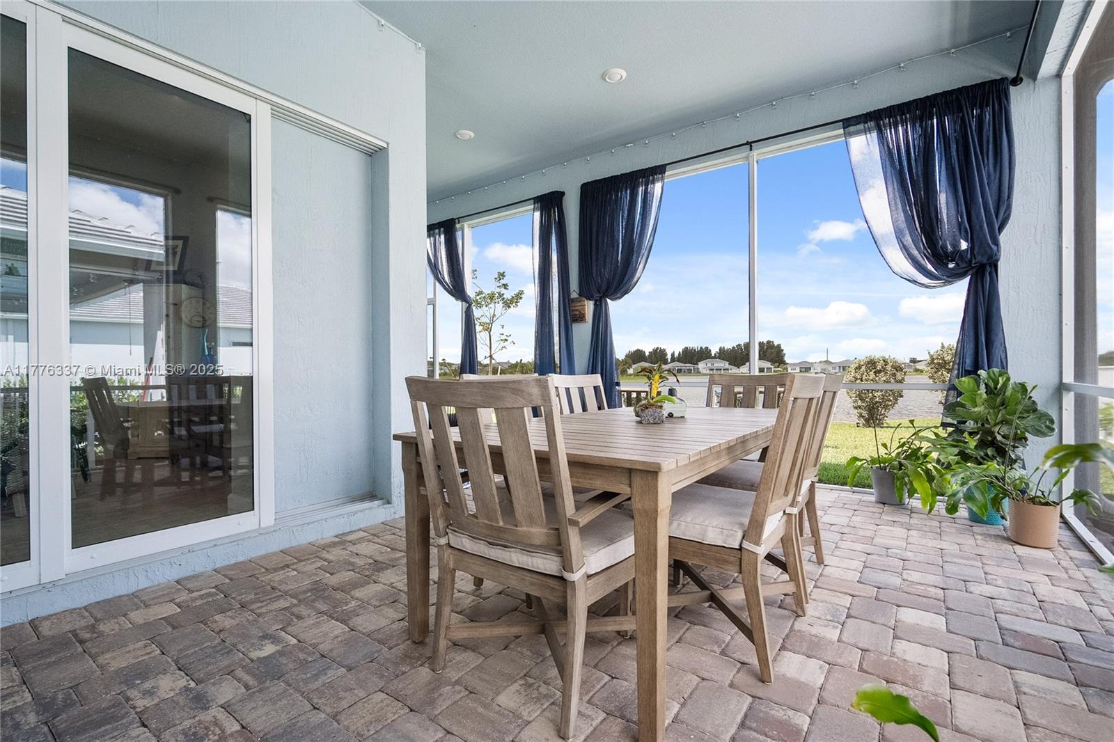 9734 Southwest Meridian Way Stuart, FL 34997 - Photo 34 of 48 a view of a dining room with furniture window and wooden floor