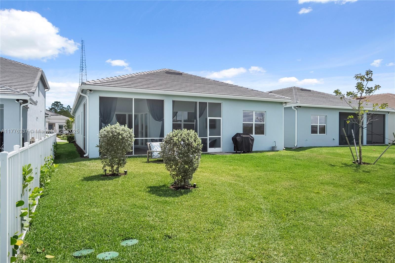 9734 Southwest Meridian Way Stuart, FL 34997 - Photo 39 of 48 a view of a house with backyard and porch