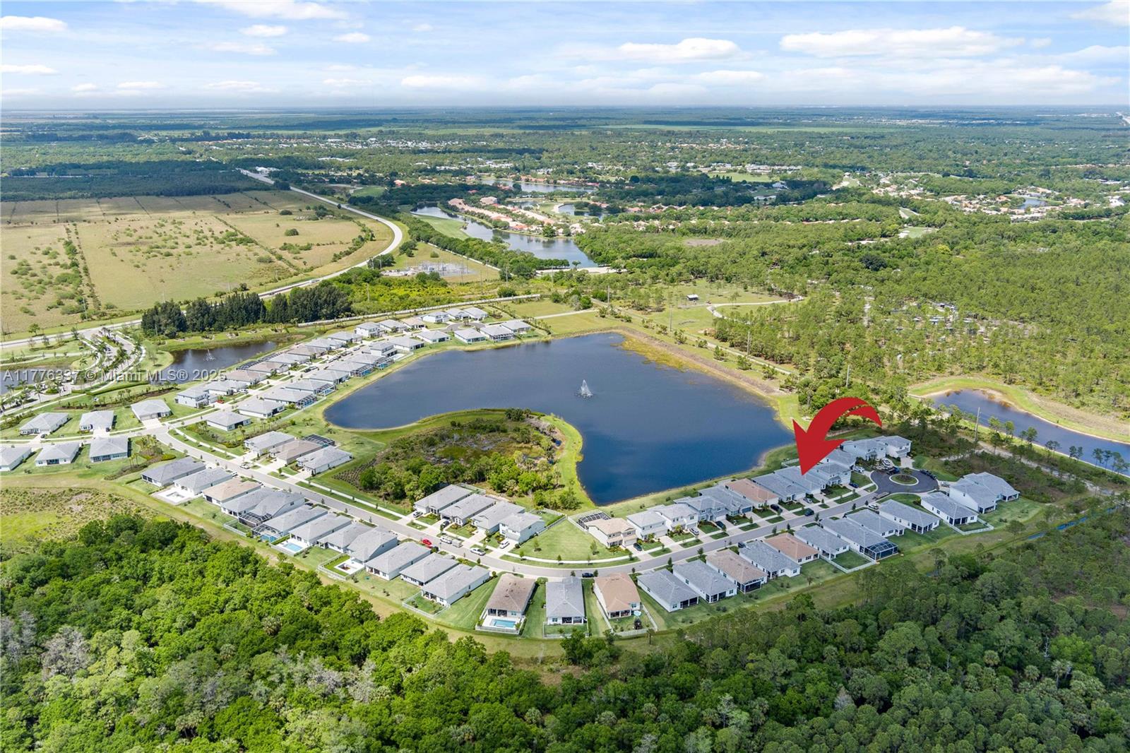 9734 Southwest Meridian Way Stuart, FL 34997 - Photo 46 of 48 an aerial view of residential houses with outdoor space