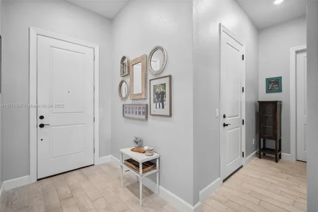 a view of room with wooden floor