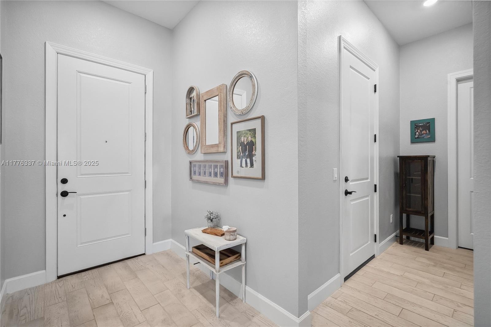 9734 Southwest Meridian Way Stuart, FL 34997 - Photo 6 of 48 a view of room with wooden floor