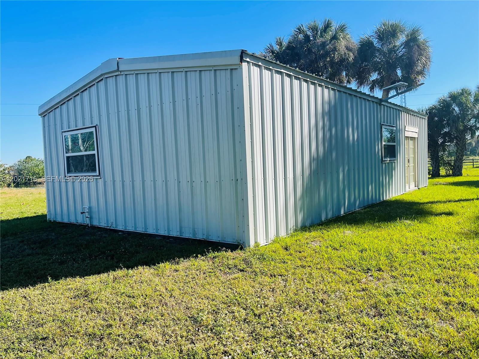 1326 Red Barn Rd N West Moore Haven, FL 33471 - Photo 3 of 13 a view of a backyard with pathway