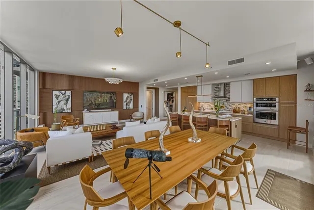 a bedroom with a large bed and a flat screen tv