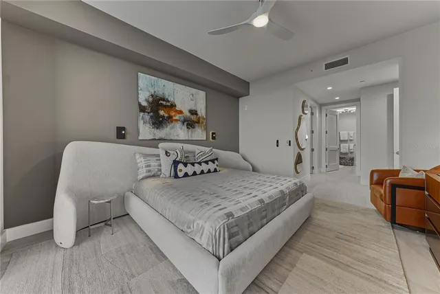 a bedroom with furniture and a window