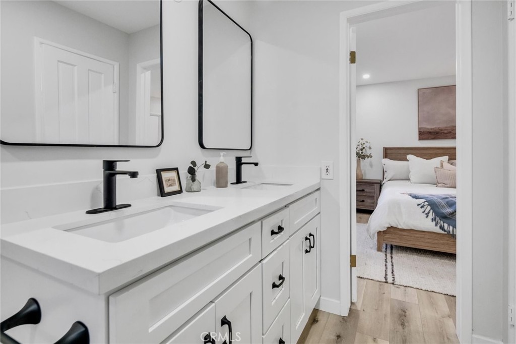 377 Hillside Road Lake Arrowhead, CA 92352 - Photo 13 of 33 a en suite bathroom with sinks and mirror