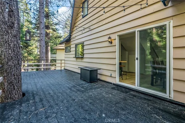 a view of a patio with couple of chairs and a couch