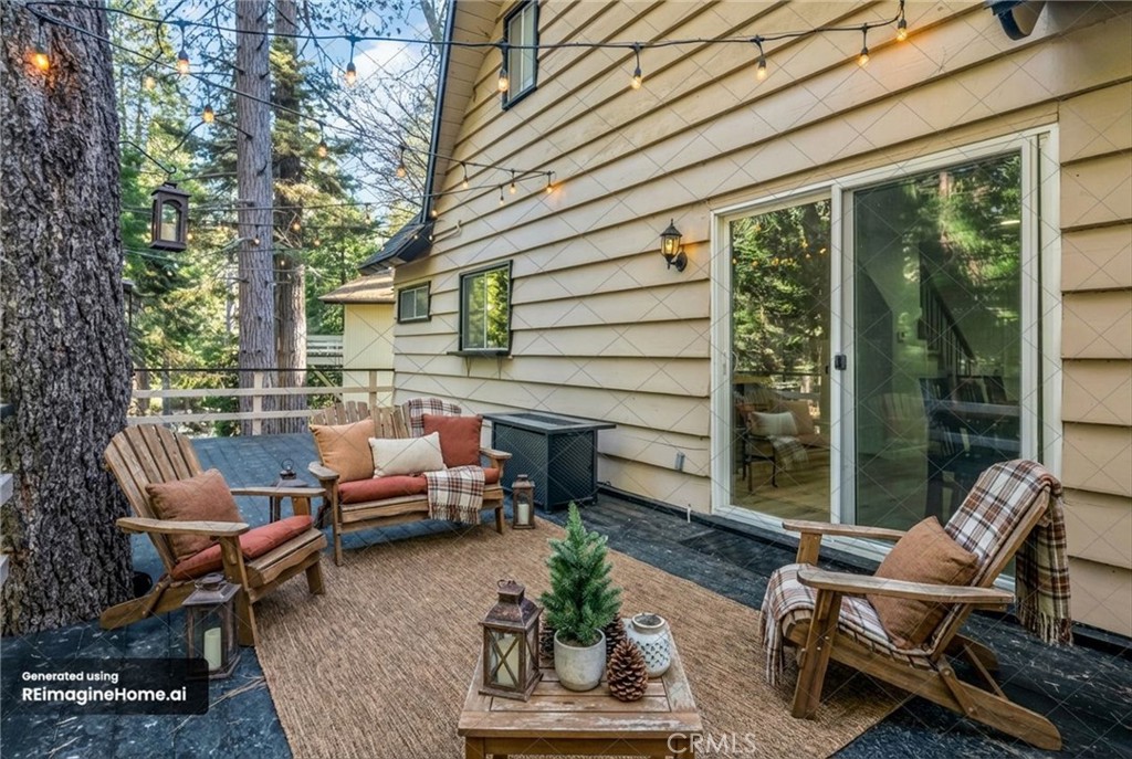 377 Hillside Road Lake Arrowhead, CA 92352 - Photo 16 of 33 a view of a patio with couple of chairs and a couch