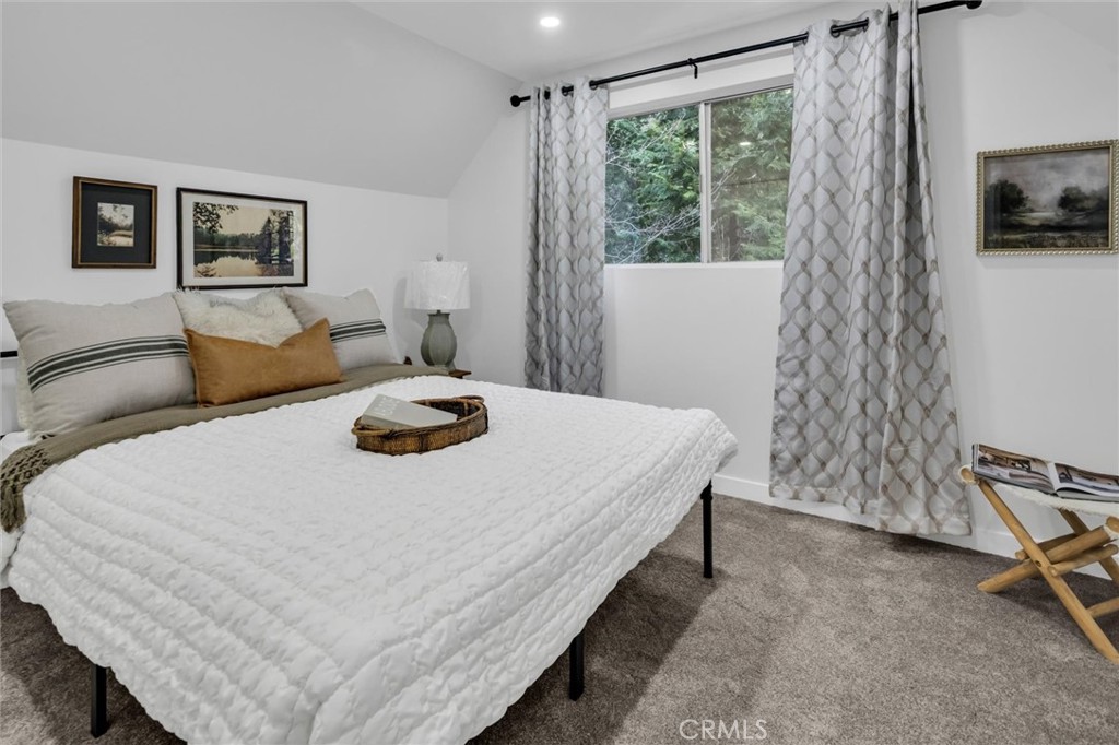 377 Hillside Road Lake Arrowhead, CA 92352 - Photo 18 of 33 a bedroom with a bed and a window