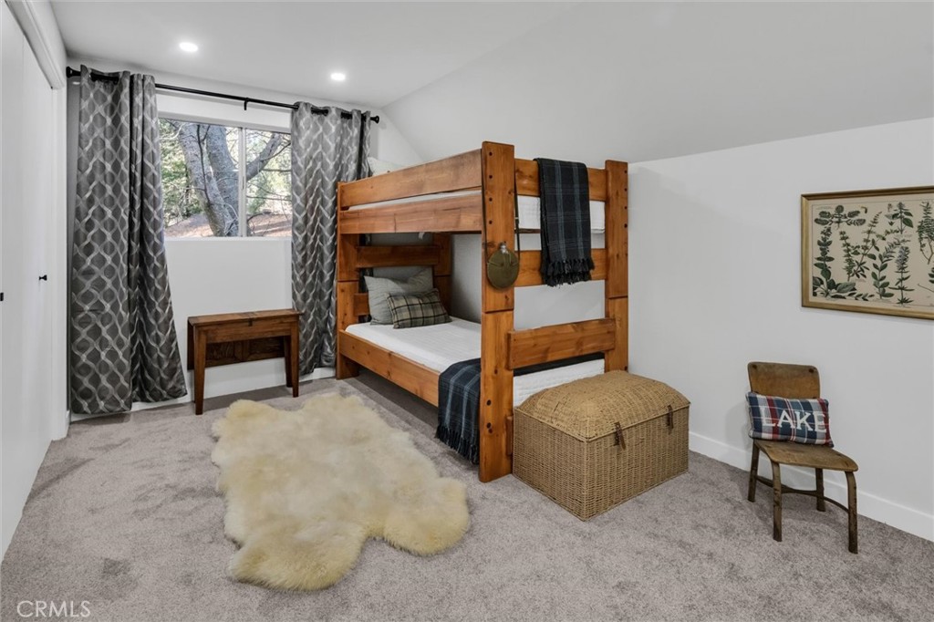 377 Hillside Road Lake Arrowhead, CA 92352 - Photo 20 of 33 a bedroom with furniture and a window