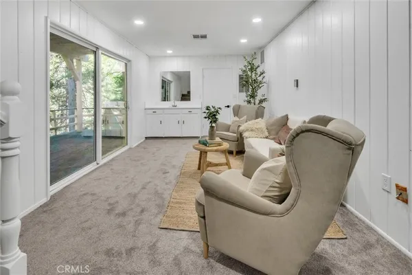 a view of an entryway with wooden floor