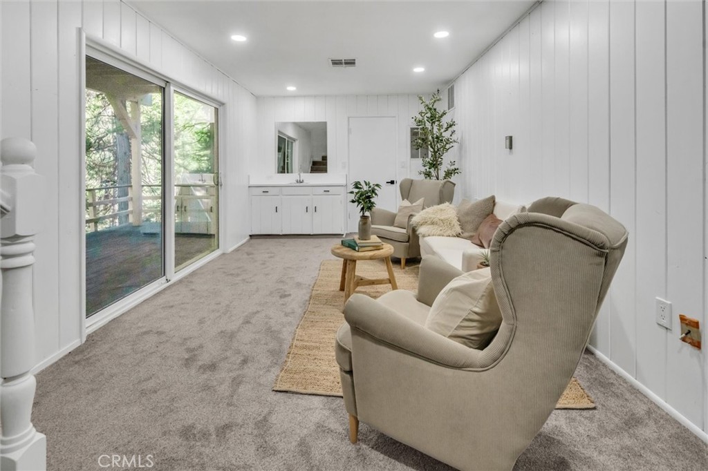 377 Hillside Road Lake Arrowhead, CA 92352 - Photo 23 of 33 a living room with furniture and a large window