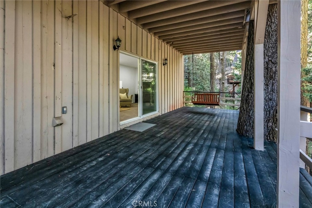 377 Hillside Road Lake Arrowhead, CA 92352 - Photo 25 of 33 a view of backyard with a deck and wooden floor