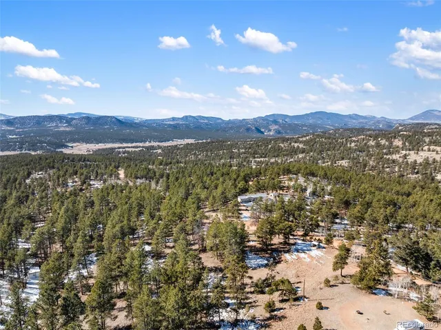 a view of a yard covered with snow in the yard