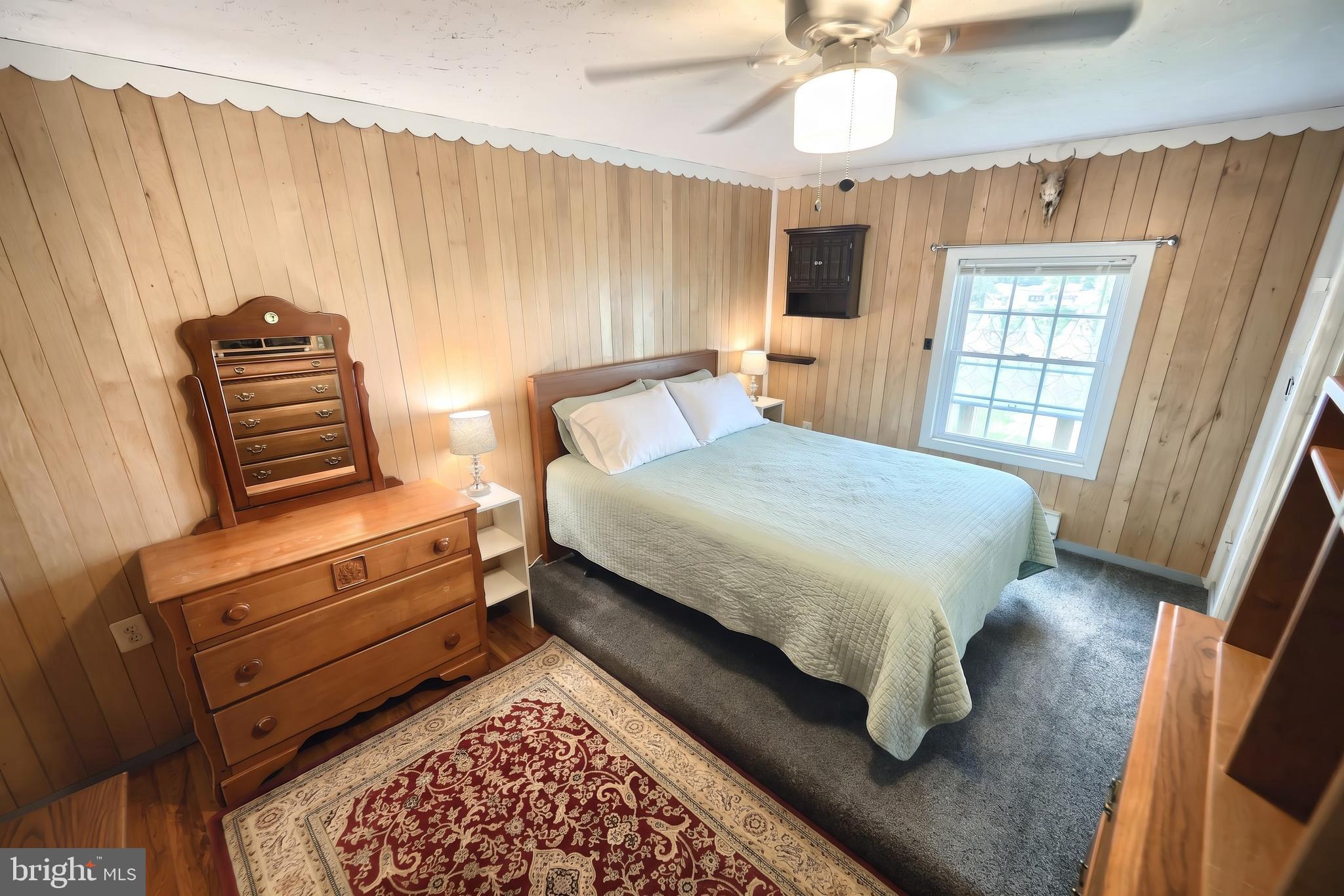 1111 Richmond Road Red Lion, PA 17356 - Photo 17 of 57 a bedroom with a bed and a chandelier