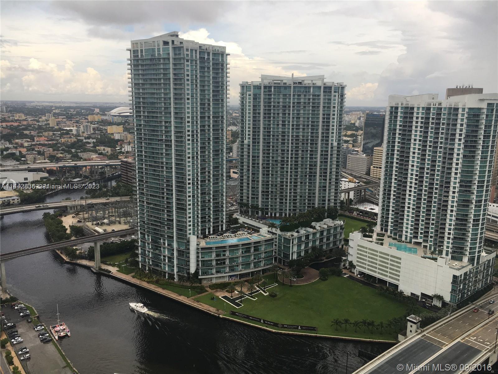 68 Southeast 6th Street, Unit 3510 Miami, FL 33131 - Photo 14 of 19 a view of a city with tall buildings