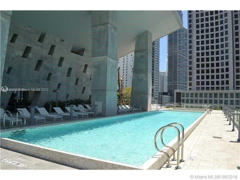 68 Southeast 6th Street, Unit 3510 Miami, FL 33131 - Photo 19 of 19 a backyard of a house with seating space