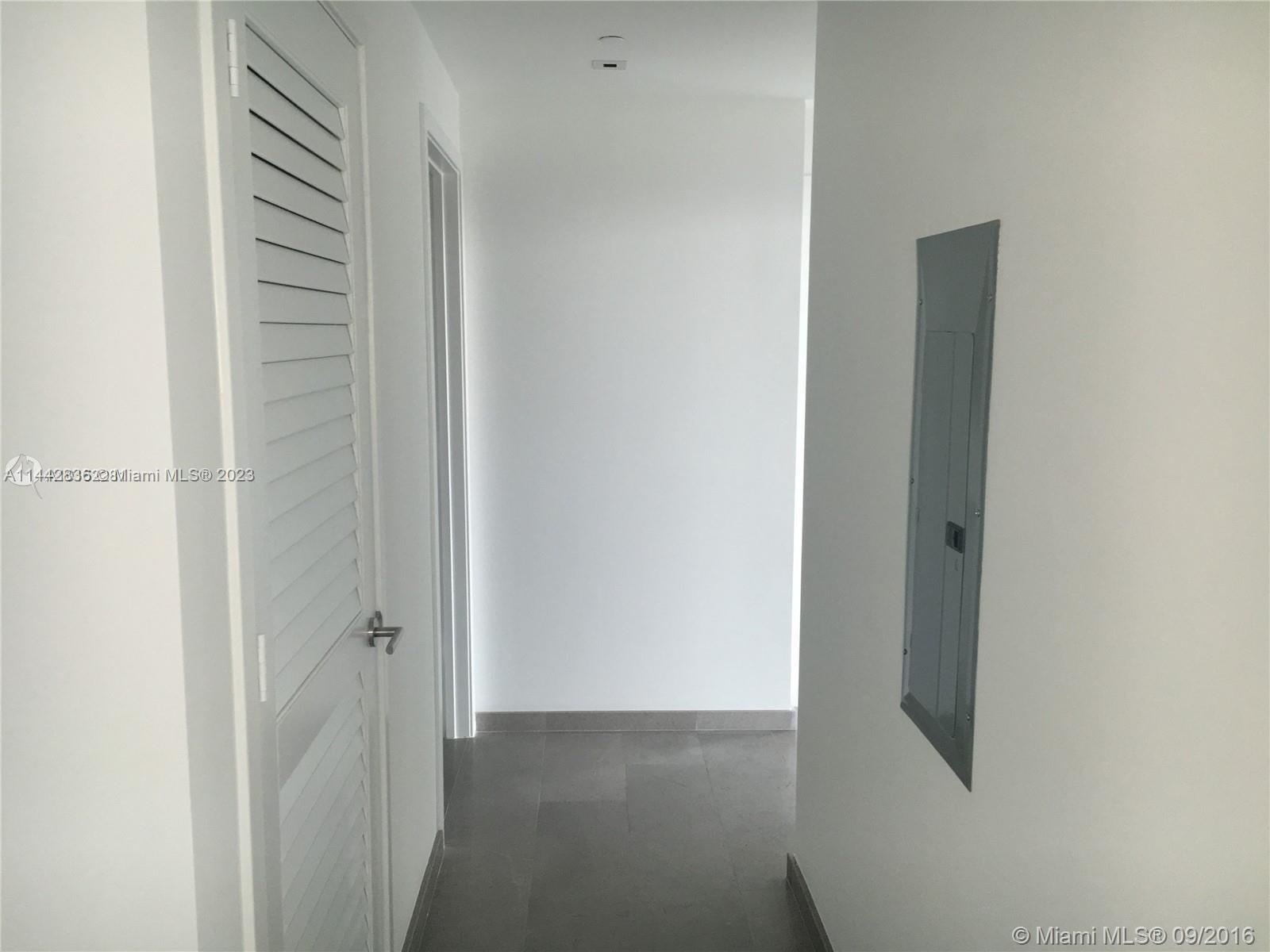 68 Southeast 6th Street, Unit 3510 Miami, FL 33131 - Photo 10 of 19 a view of a hallway