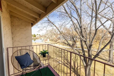 a view of balcony with furniture
