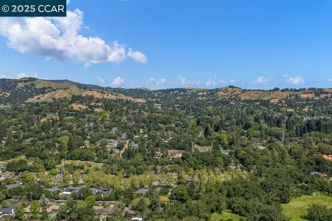 a view of a city with mountains in the background