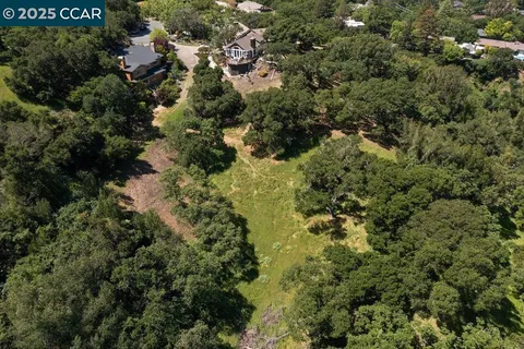 a view of a town with mountains in the background
