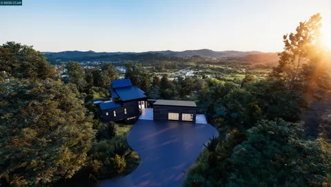 a view of a city with lush green forest