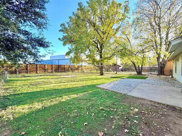 a view of swimming pool with green space