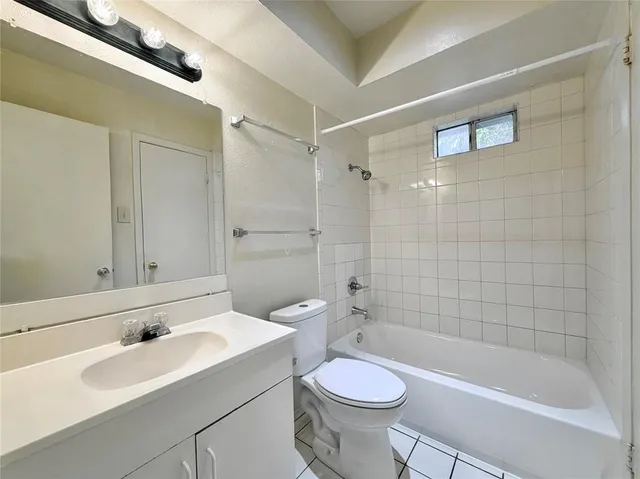 a bathroom with a sink a toilet and a bathtub