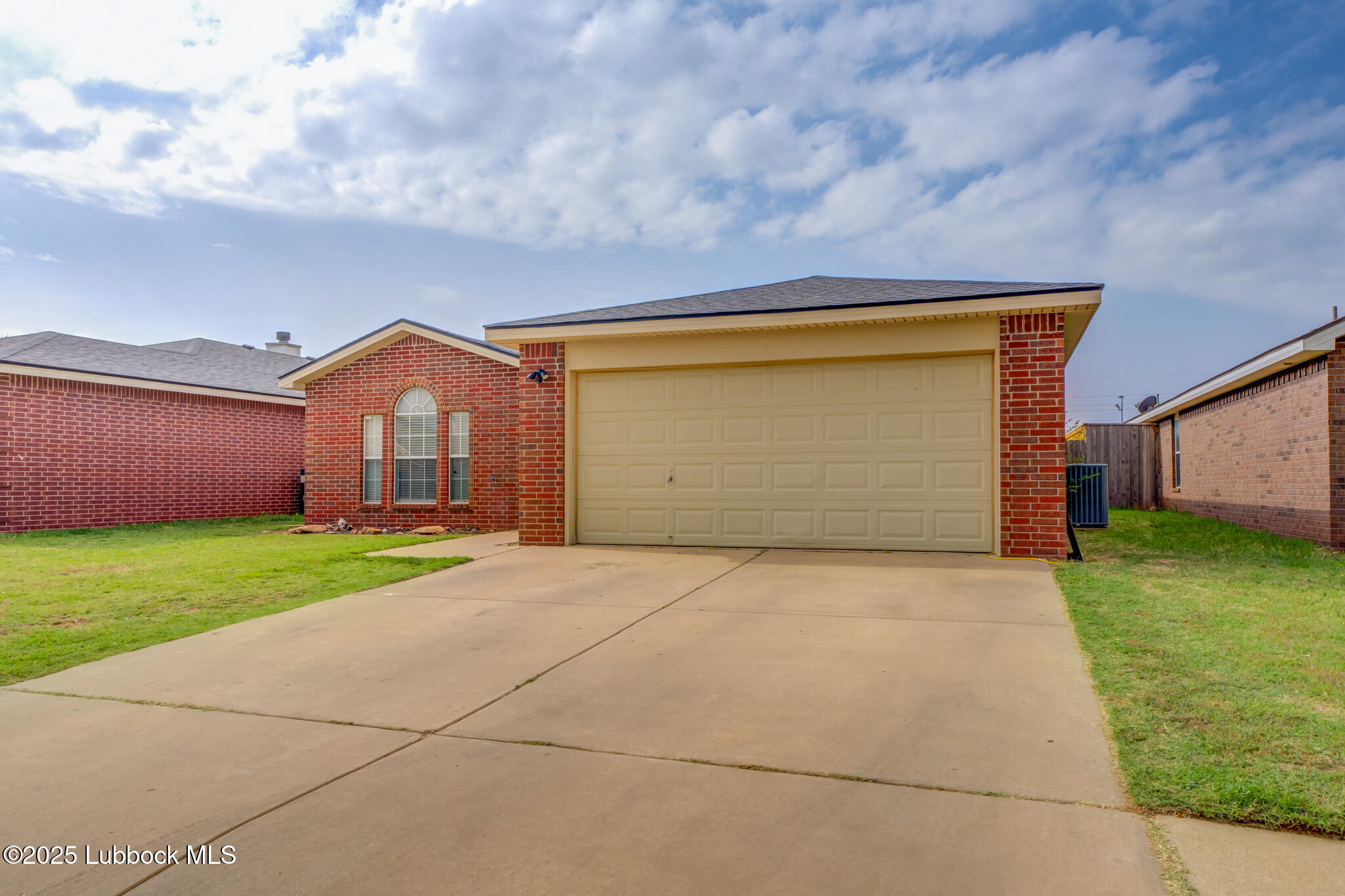 6223 18th Street Lubbock, TX 79416 - Photo 2 of 29 a front view of a house with garden