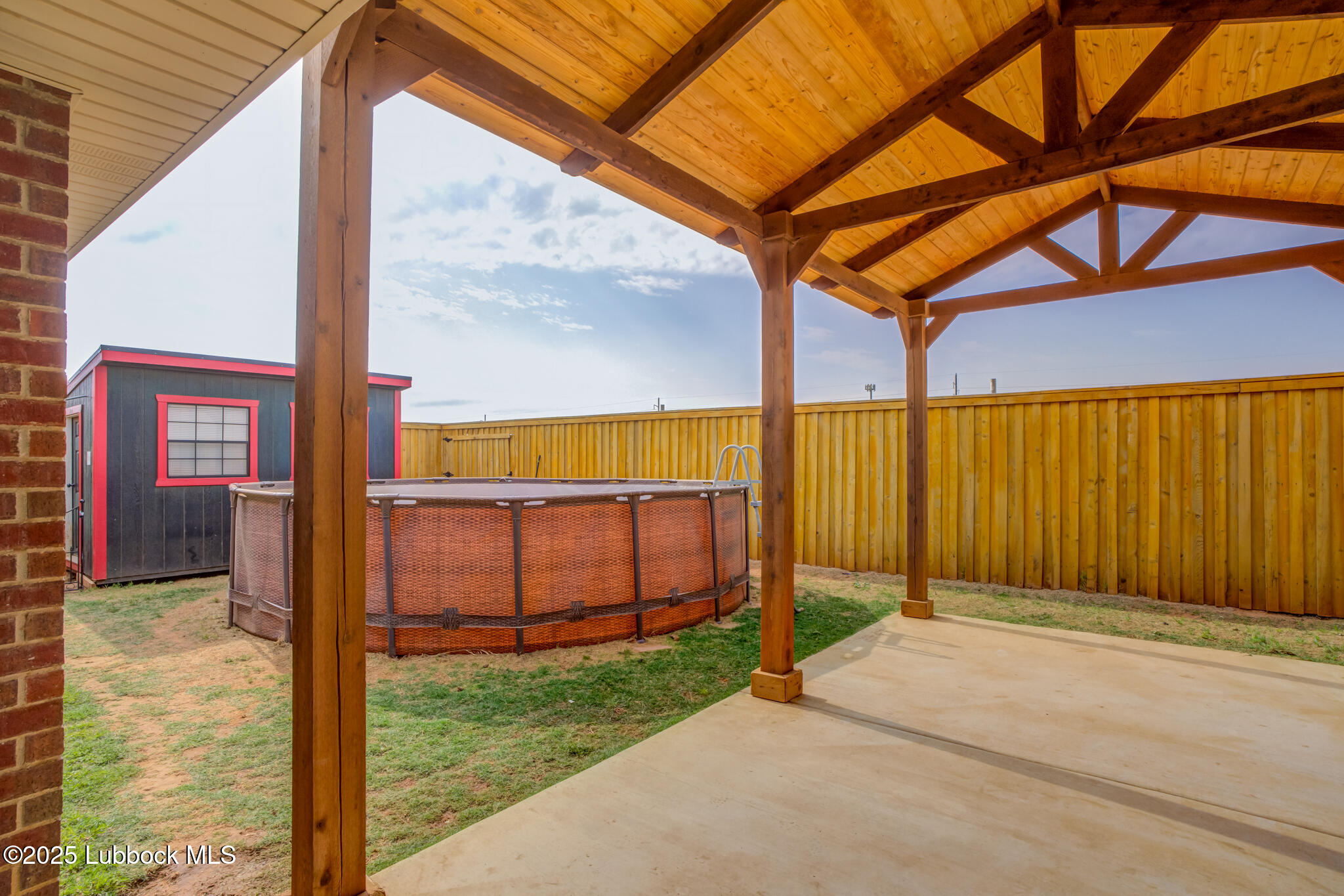 6223 18th Street Lubbock, TX 79416 - Photo 27 of 29 a view of a door with a backyard