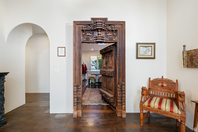 779 South Silver Road Leeds, UT 84746 - Photo 32 of 80 Hallway featuring arched walkways and dark stone finish floors