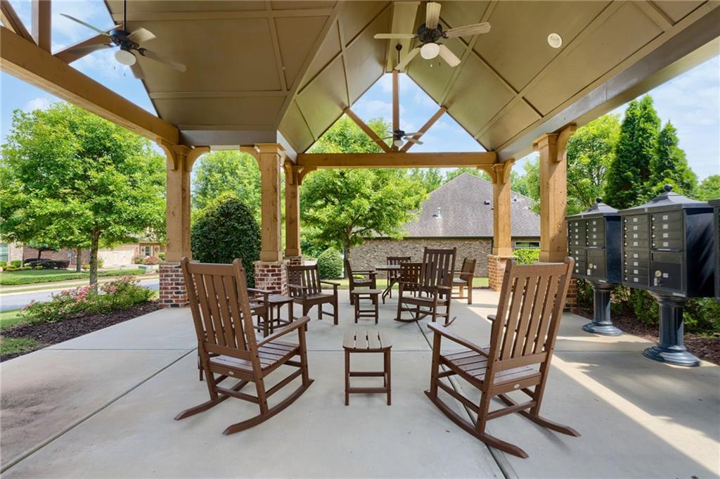 4735 Amble Trace Cumming, GA 30040 - Photo 71 of 73 a view of a patio with a table chairs and a backyard
