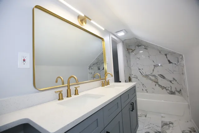 a bathroom with a bathtub and a sink