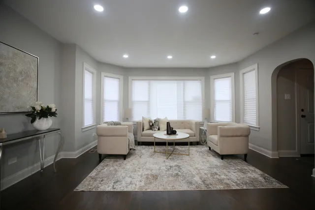 a living room with furniture and a window