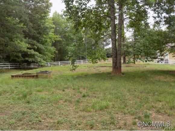 418 Chisholm Trail Rutherfordton, NC 28139 - Photo 2 of 22 a view of a yard with trees