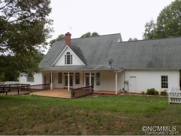 418 Chisholm Trail Rutherfordton, NC 28139 - Photo 16 of 22 a view of a house with a backyard