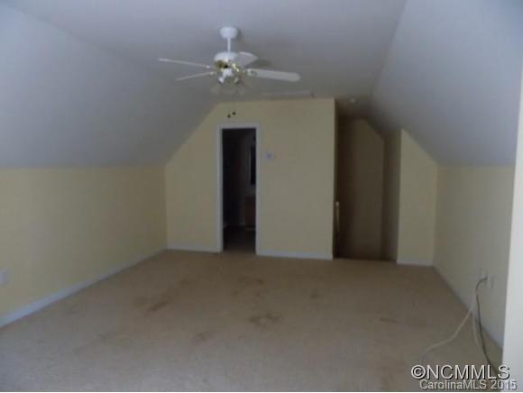 418 Chisholm Trail Rutherfordton, NC 28139 - Photo 17 of 22 a view of an empty room with a chandelier fan