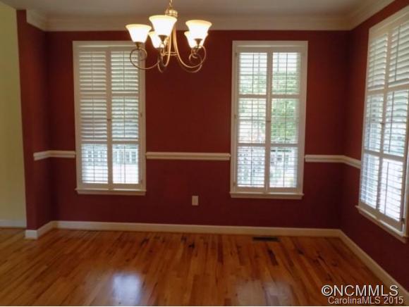 418 Chisholm Trail Rutherfordton, NC 28139 - Photo 18 of 22 a view of an empty room with wooden floor and a window