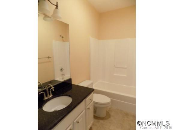 418 Chisholm Trail Rutherfordton, NC 28139 - Photo 19 of 22 a bathroom with a granite countertop sink toilet and shower