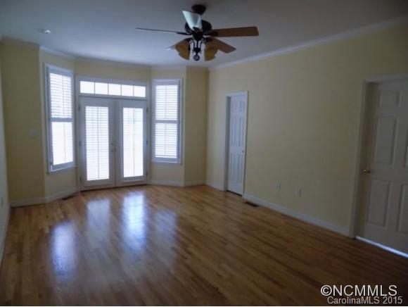 418 Chisholm Trail Rutherfordton, NC 28139 - Photo 20 of 22 a view of an empty room with a window and wooden floor