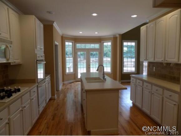 418 Chisholm Trail Rutherfordton, NC 28139 - Photo 7 of 22 a kitchen with sink stove and cabinets
