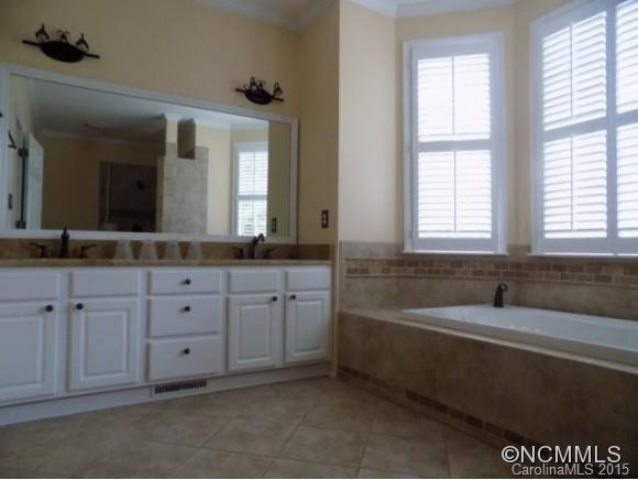 418 Chisholm Trail Rutherfordton, NC 28139 - Photo 8 of 22 a spacious bathroom with a tub sink and mirror