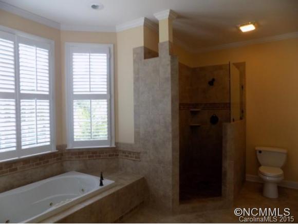 418 Chisholm Trail Rutherfordton, NC 28139 - Photo 9 of 22 a bathroom with a bathtub and a toilet