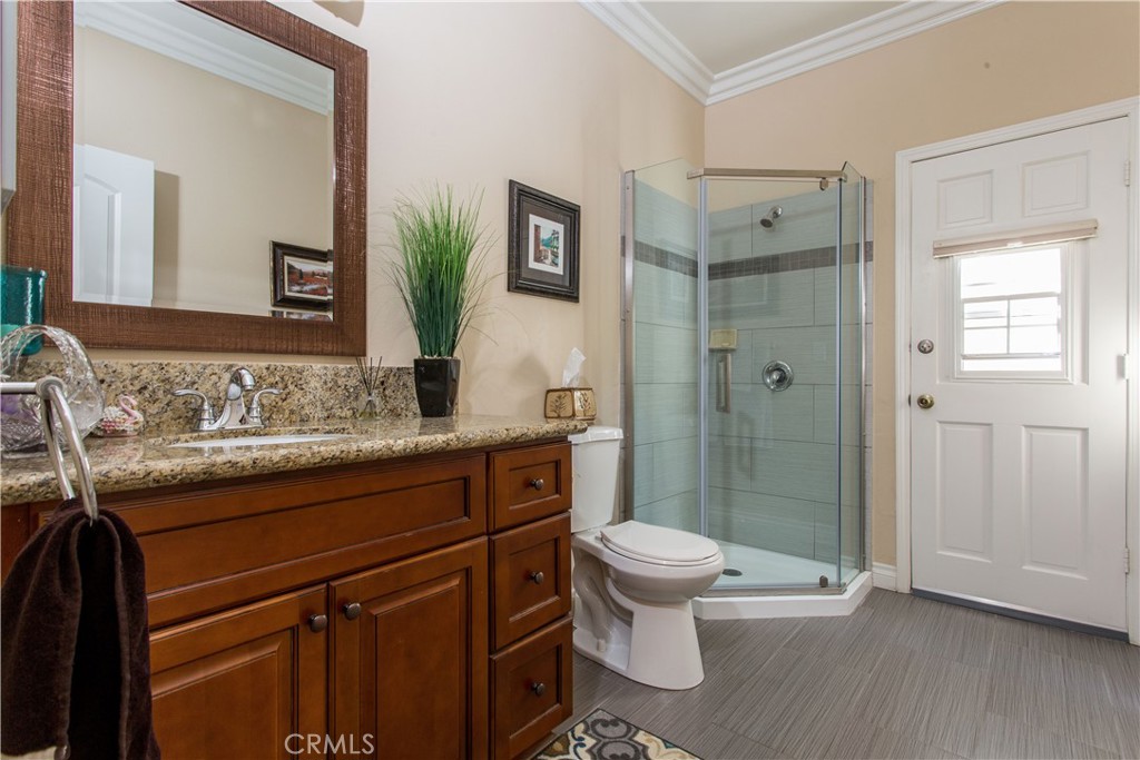 30311 Goodspring Drive Agoura Hills, CA 91301 - Photo 13 of 18 a bathroom with a granite countertop sink toilet and shower