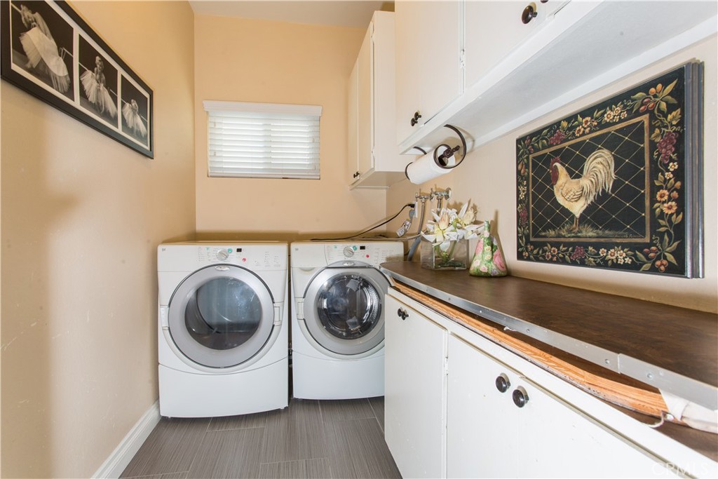 30311 Goodspring Drive Agoura Hills, CA 91301 - Photo 16 of 18 a utility room with dryer and washer