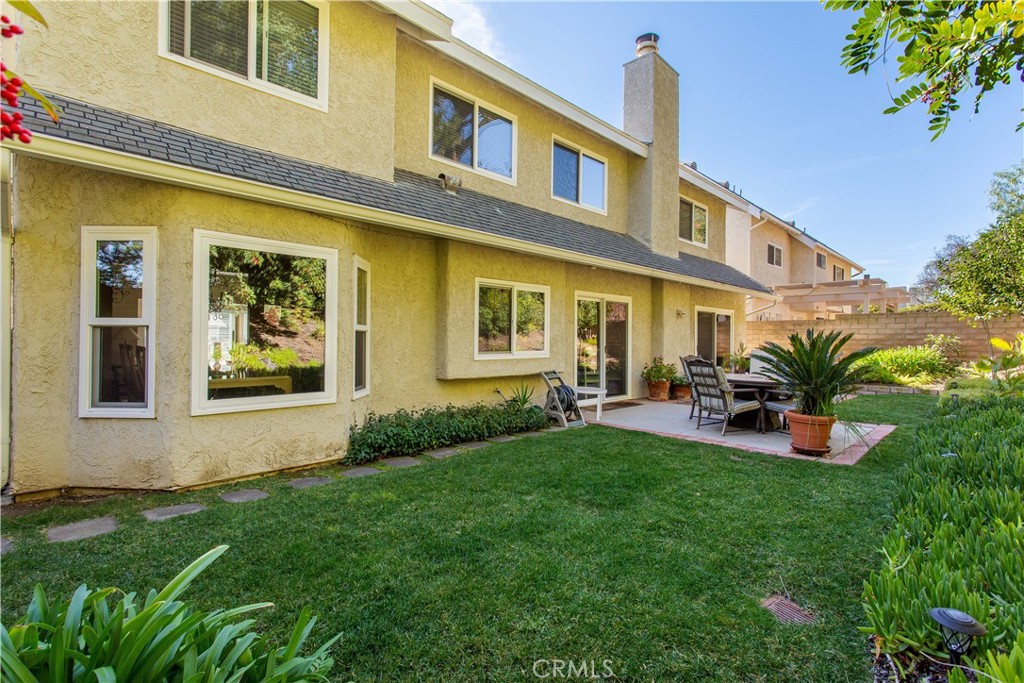 30311 Goodspring Drive Agoura Hills, CA 91301 - Photo 17 of 18 a view of an house with backyard porch and sitting area