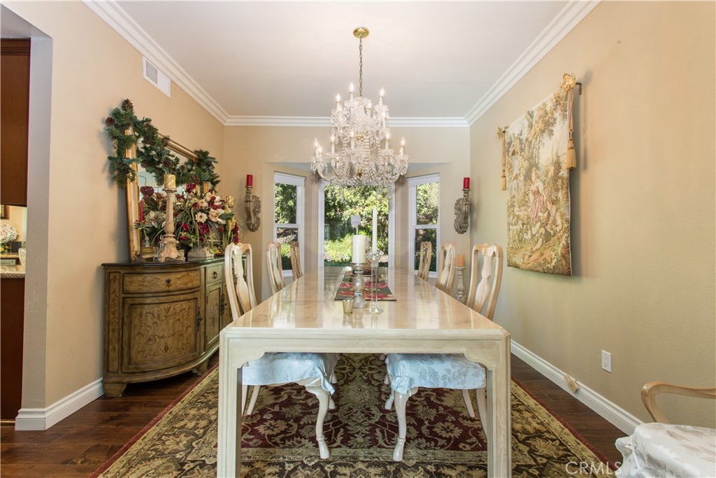 30311 Goodspring Drive Agoura Hills, CA 91301 - Photo 4 of 18 a view of a dining room with furniture and chandelier