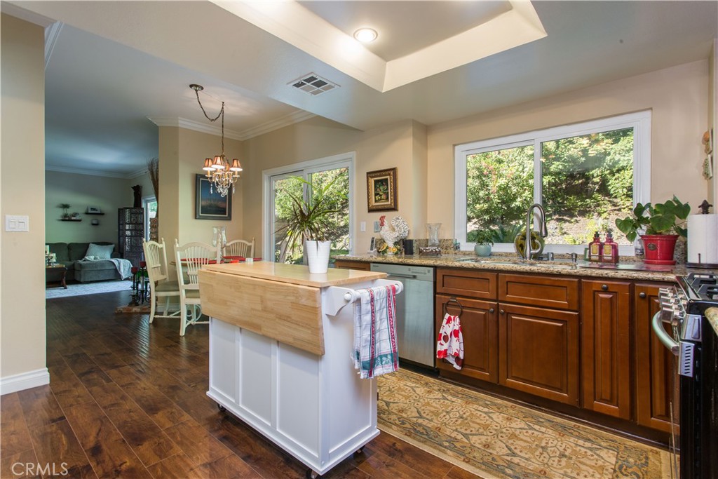 30311 Goodspring Drive Agoura Hills, CA 91301 - Photo 7 of 18 a living room with granite countertop furniture and a floor to ceiling window