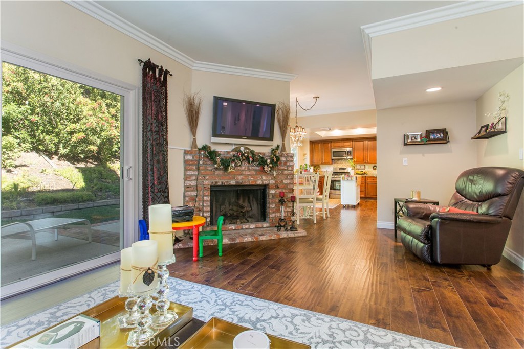 30311 Goodspring Drive Agoura Hills, CA 91301 - Photo 8 of 18 a living room with furniture and a fireplace