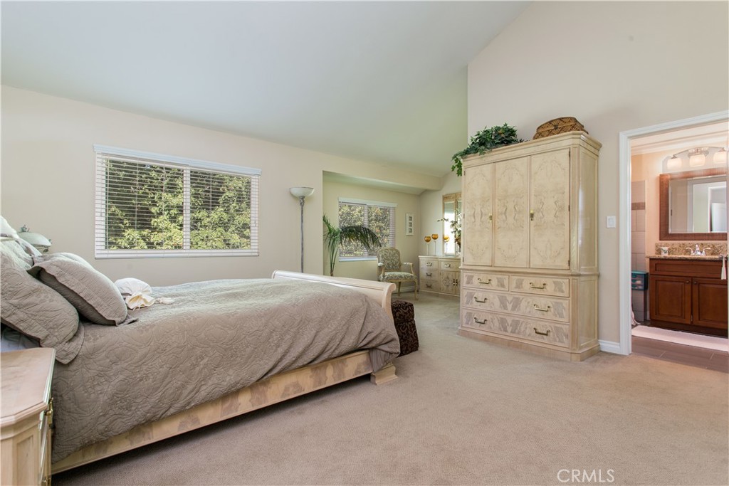 30311 Goodspring Drive Agoura Hills, CA 91301 - Photo 10 of 18 a bedroom with a bed and a cabinets