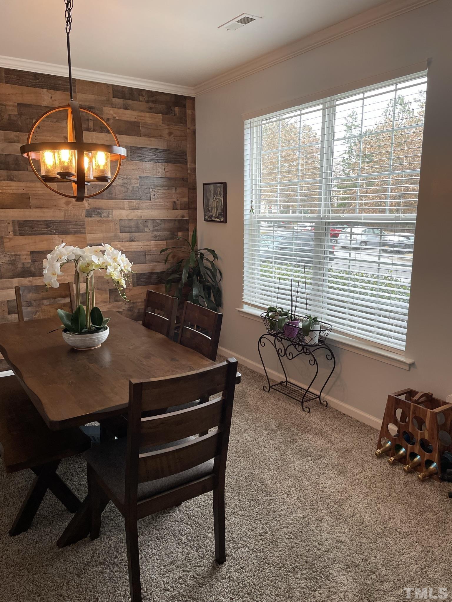 1206 Maroon Drive Durham, NC 27713 - Photo 3 of 11 a view of a dining room with furniture window and outside view